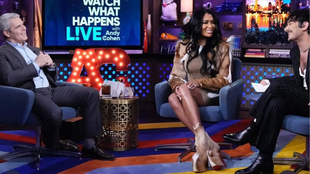 Brit Eady Appeared on WWHL in a Brown Vintage Roberto Cavalli Dress with a Dior Handbag and Christian Louboutin Boots