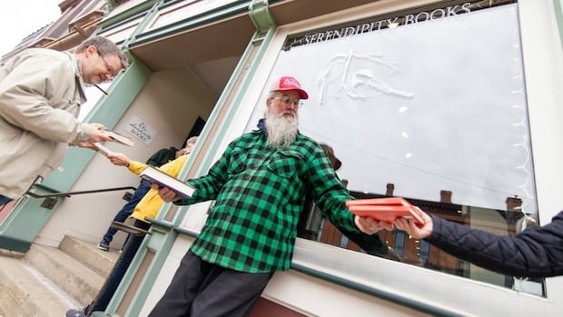 Why a Michigan community formed a human chain to move 9,100 books, one at a time