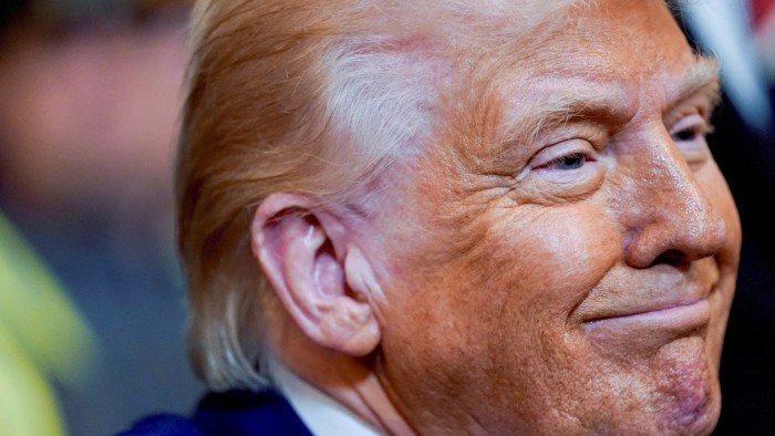 Donald Trump defies market tumult and pushes ahead with trade war