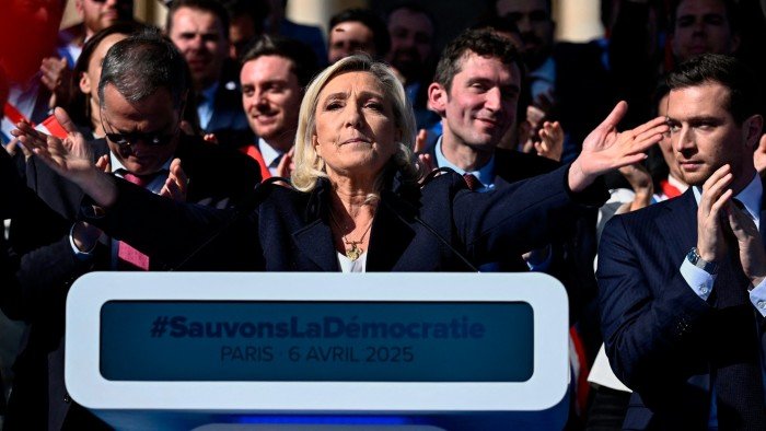 Marine Le Pen rages against political ‘witch-hunt’ at Paris rally