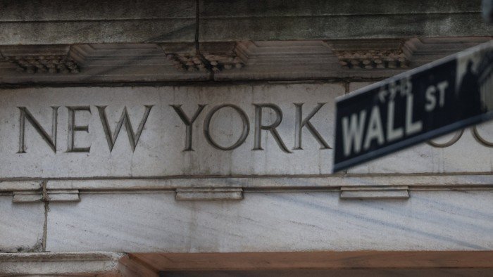 US stocks end slightly lower after day of turbulence on Wall Street