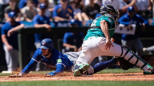 Instead of travelling to Seattle to watch the Blue Jays, some B.C. baseball fans are staying home