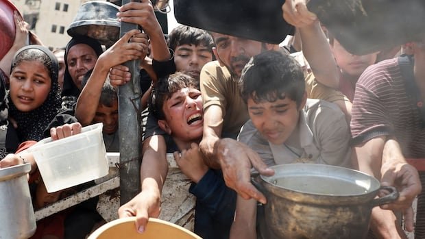 Mother, newborn among at least 36 killed in Israeli strikes as some aid trickles in