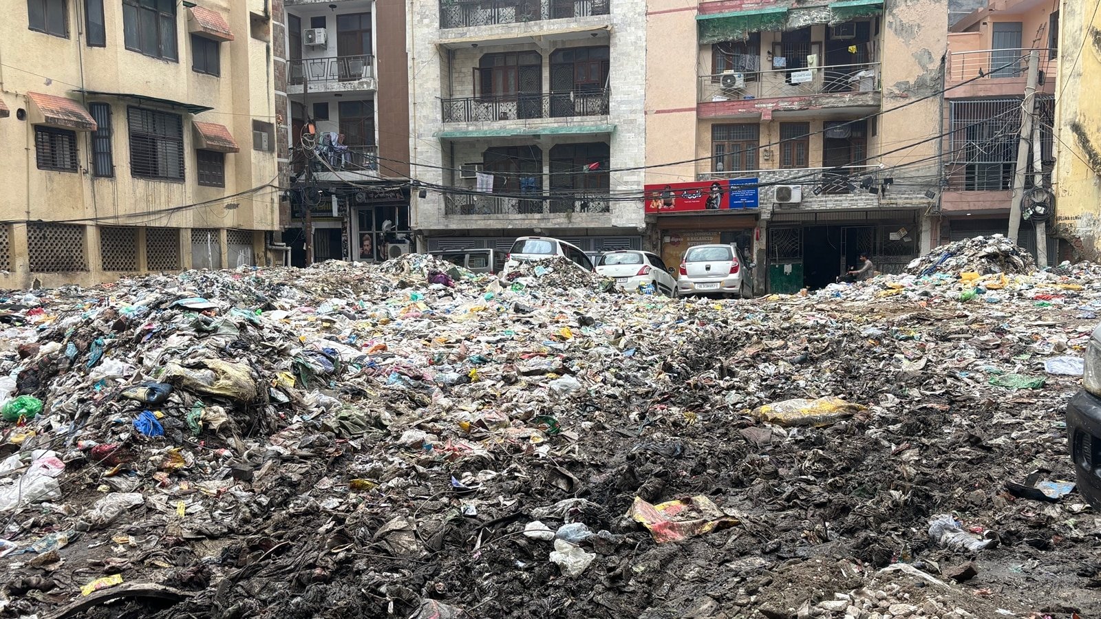 ‘After work, I stand guard’: In Delhi’s Okhla, locals on patrol to stop trash dumping outside homes | Delhi News